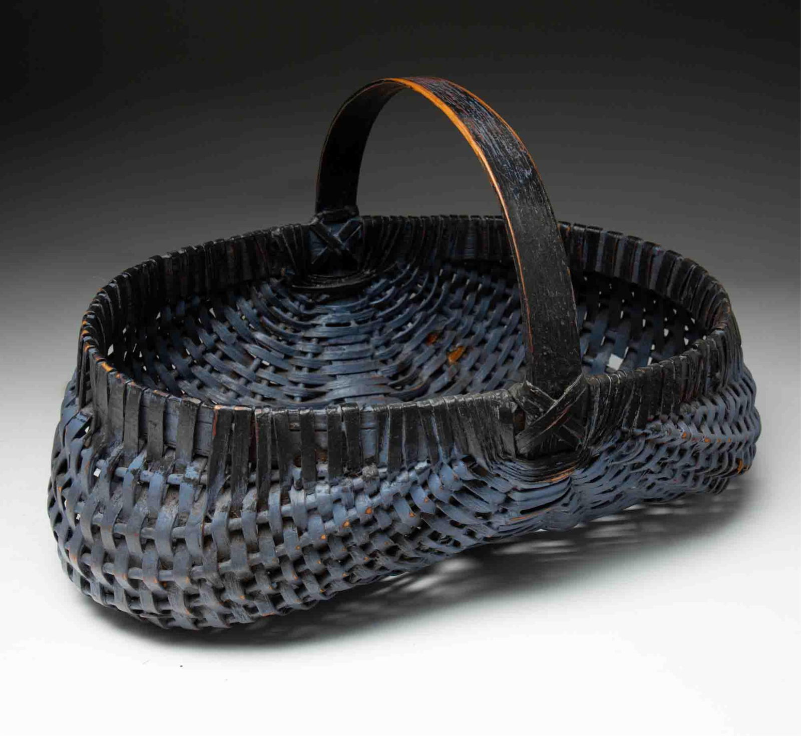AMERICAN BLACK AND BLUE-PAINTED BUTTOCKS BASKET. (1 of 4)