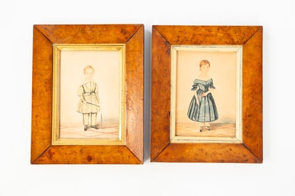 PAIR OF AMERICAN SCHOOL DIMINUTIVE FOLK ART WATERCOLOR PORTRAITS OF A BOY AND GIRL.
