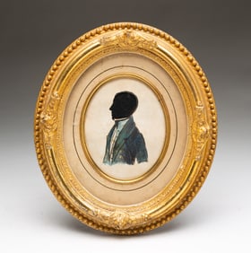 AMERICAN SCHOOL HOLLOW-CUT AND WATERCOLOR SILHOUETTE OF A MAN.