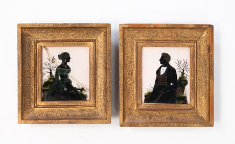 PAIR OF BRITISH SCHOOL DIMINUTIVE REVERSE-GLASS SILHOUETTE PORTRAITS OF A MAN AND WOMAN.