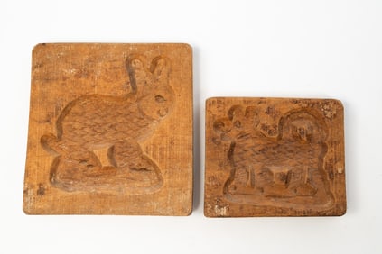 TWO CARVED WOOD COOKIE BOARDS.