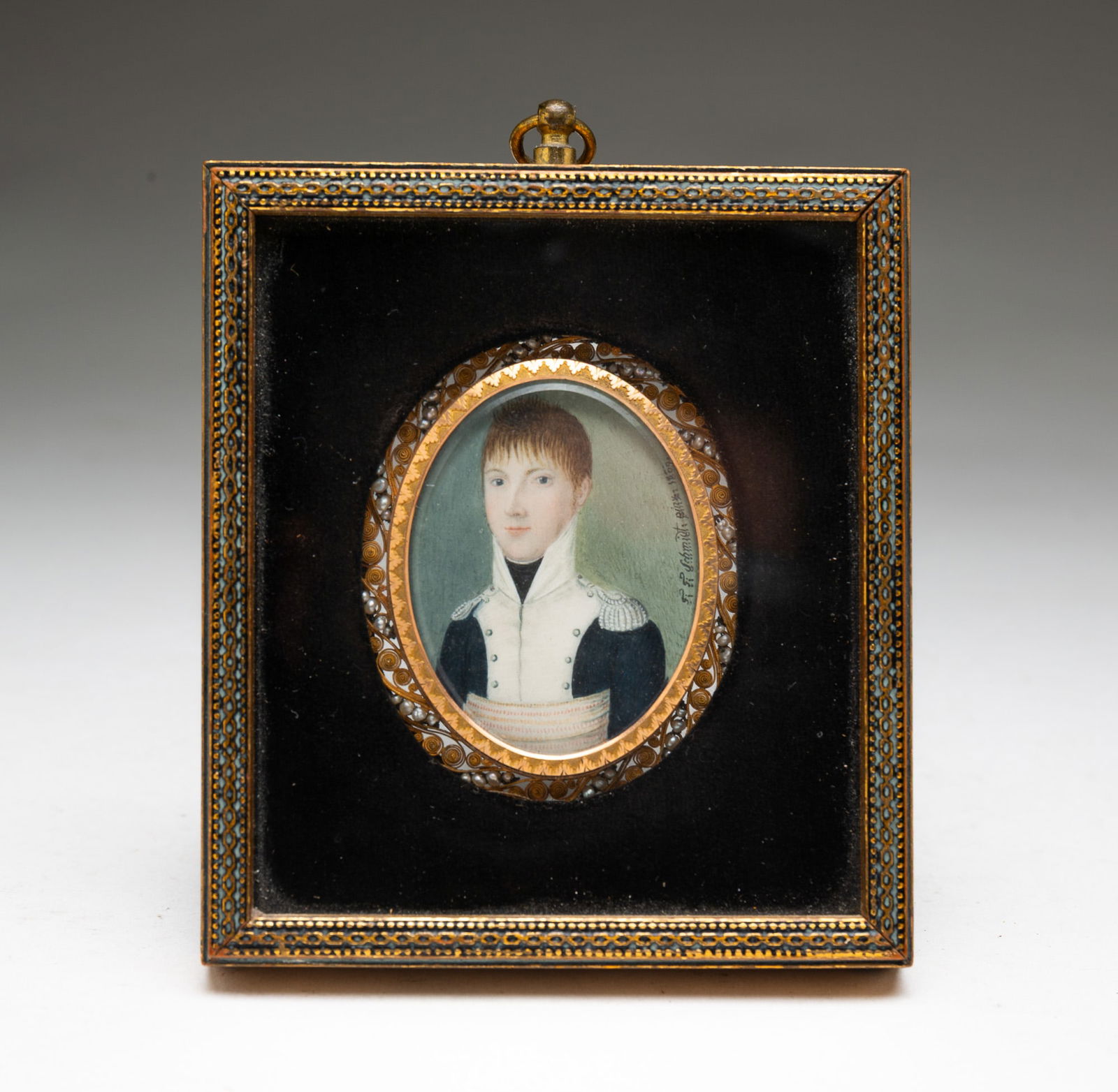 F. F. SCHMIDT FRENCH SCHOOL MINIATURE WATERCOLOR PORTRAIT OF A YOUNG NAVAL OFFICER WITH A HAIR: France, dated 1809. Watercolor, gouache, and hair on wafer of natural material. One side depicting a young man in French naval attire signed "F. F. Schmidt Pinx 1809." The verso having a sheaf of whea