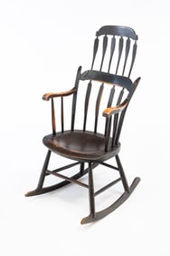 AMERICAN EBONIZED WINDSOR ARROW-BACK ROCKER WITH COMB.