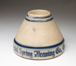 NEW YORK COBALT-DECORATED STONEWARE ADVERTISING MATCH HOLDER AND STRIKER.