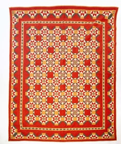 AMERICAN PIECED COTTON "AUTUMN STARBURST" QUILT.