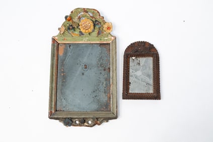 TWO INTRICATELY DECORATED FRAMED MIRRORS.