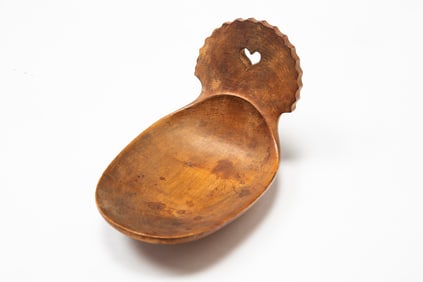 AMERICAN CARVED MAPLE SCOOP WITH CUTOUT HEART.