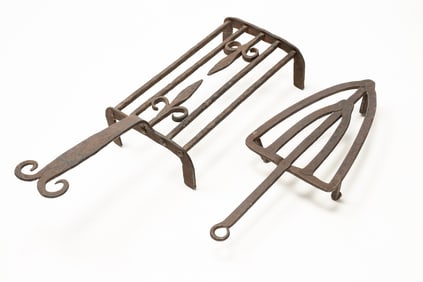 TWO FORGED IRON TRIVETS.