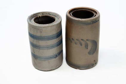 TWO STONEWARE CANNING JARS WITH COBALT DECORATION.