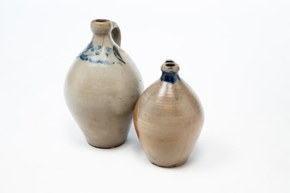 TWO AMERICAN STONEWARE JUGS WITH COBALT DECORATION.