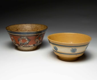 TWO BOWLS WITH MOCHA DECORATION.