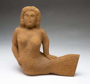 ERNEST "POPEYE" REED (OHIO, 1919-1985) FOLK ART DIMINUTIVE CARVED STONE MERMAID.