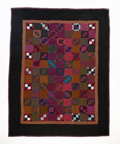 AMISH (HOLMES COUNTY, OHIO) WOOL AND COTTON "CONTAINED FOUR PATCH VARIATION" QUILT.