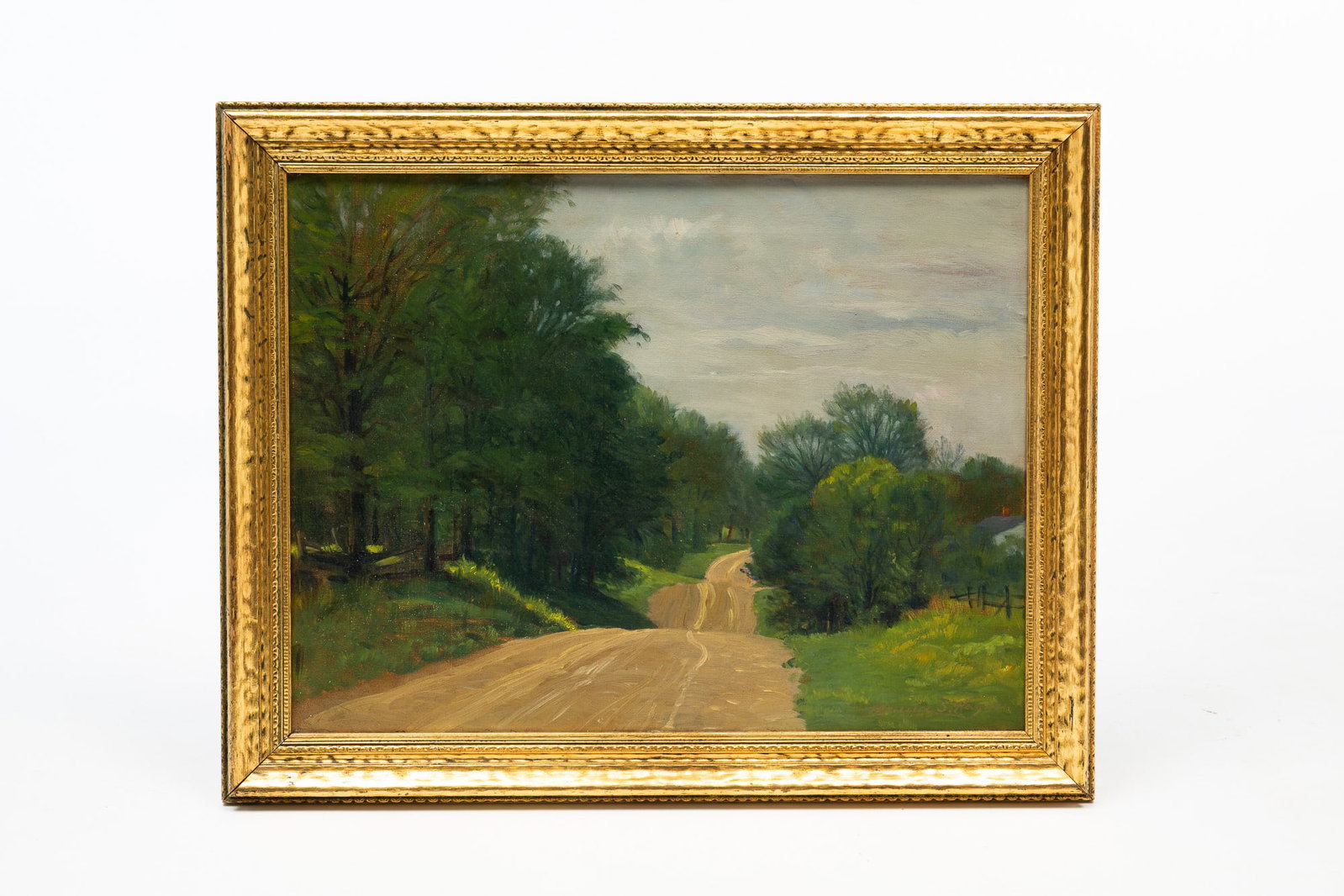 MAURICE STEWART HAGUE (OHIO, 1862-1943) "THE SUNBURY ROAD" OIL ON CANVAS.: Maurice Stewart Hague (Ohio, 1862-1943). Oil on canvas. Depicting a dirt road flanked by grass and trees, all of which is set against a blue sky. Signed to lower right. Canvas, 16"h. 21"w. Framed, 19.