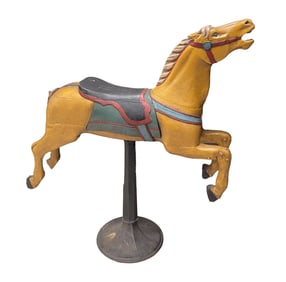 AMERICAN FOLK ART CARVED AND PAINT-DECORATED GALLOPING CAROUSEL HORSE.