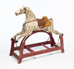 AMERICAN CARVED AND PAINTED WOOD ROCKING HORSE ON GLIDER BASE.
