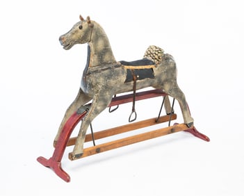 AMERICAN CARVED AND PAINTED WOOD ROCKING HORSE ON GLIDER BASE.