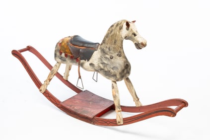 AMERICAN CARVED AND PAINTED WOOD ROCKING HORSE.