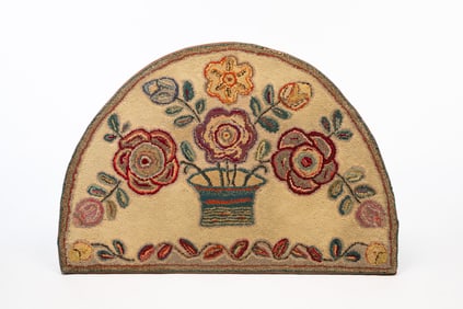 AMERICAN HALF-ROUND FLORAL HOOKED RUG.