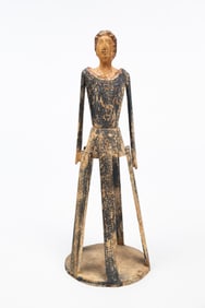 EUROPEAN CARVED AND POLYCHROMED CAGE DOLL.