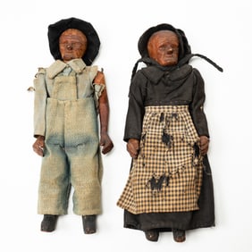 ATTRIBUTED TO POLLY PAGE (TENNESSEE, 1919-2020) TWO CARVED FOLK ART DOLLS.