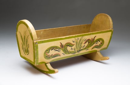 AMERICAN PAINT-DECORATED WALNUT AND PINE DOLL CRADLE.