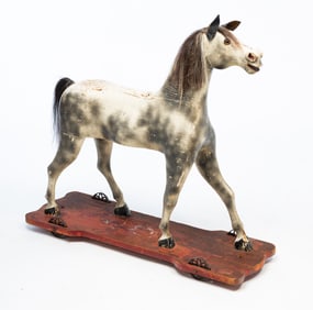 LARGE GERMAN CARVED AND PAINTED PINE HORSE PULL TOY.
