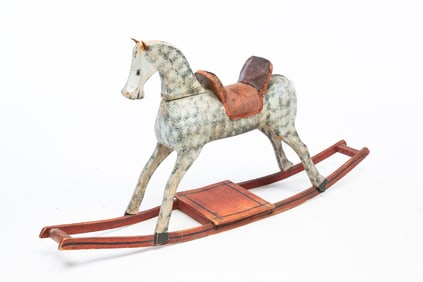 AMERICAN CARVED AND PAINTED WOOD ROCKING HORSE.