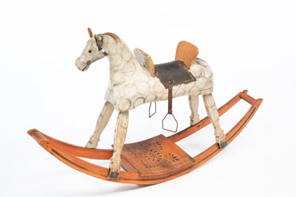 AMERICAN CARVED AND PAINTED WOOD ROCKING HORSE.