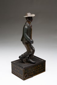 FERDINAND STRAUSS TIN WIND-UP DANCING TOY.