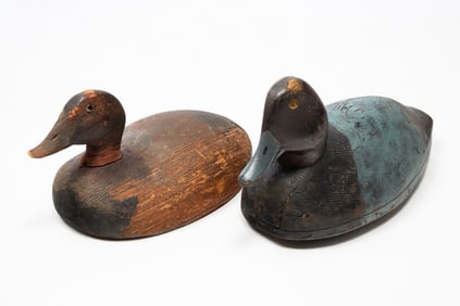 TWO ED "ONE ARM" KELLIE (MONROE, MICHIGAN, 1883-1955) CARVED REDHEAD AND BLUEBILL DUCK DECOYS.