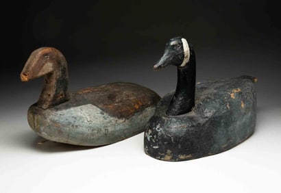 TWO AMERICAN FOLKSY CARVED AND PAINTED GOOSE DECOYS.
