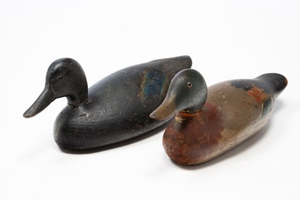 TWO AMERICAN CARVED AND PAINTED WORKING DUCK DECOYS.