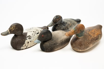FOUR CARVED WOOD DUCK DECOYS.
