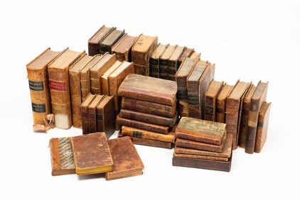 A COLLECTION OF MOSTLY LEATHER BOUND BOOKS.