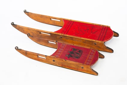 TWO AMERICAN WROUGHT IRON-MOUNTED AND PAINT-DECORATED WOOD SLEDS, INCL. PARIS MFG. CO. (SOUTH PARIS,