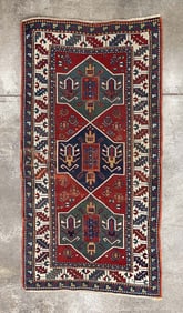 KAZAK AREA RUG.