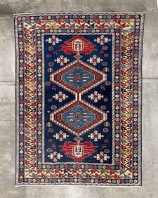 SHIRVAN AREA RUG.