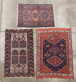 THREE PERSIAN AREA RUGS.