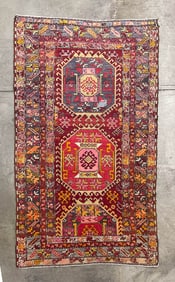KAZAK AREA RUG.