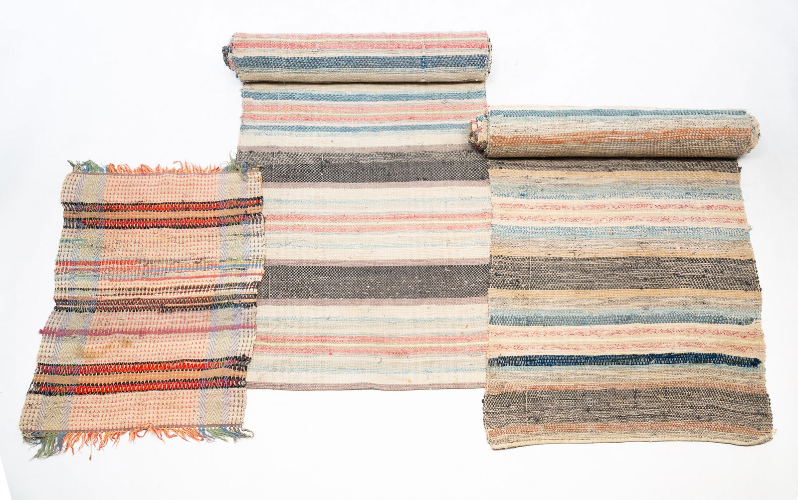 TWO AMERICAN POLYCHROME RAG RUG RUNNERS AND A WOVEN SCATTER RUG. (1 of 4)