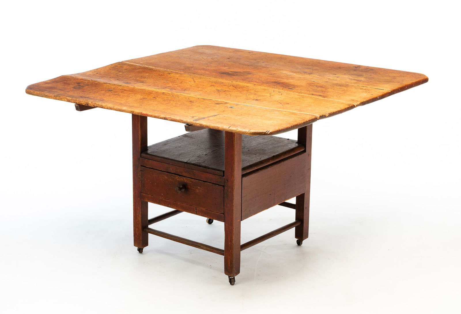 AMERICAN REDDISH-BROWN PAINTED WALNUT AND PINE HUTCH TABLE.: American, Early 19th Century. Walnut and pine. Scrubbed two board rectangular top with battens,base with turned arms, square corner posts, one board seat, dovetailed drawer and pegged construction. Re