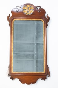 CHIPPENDALE MAHOGANY AND PARCEL-GILT FRET-CARVED MIRROR.