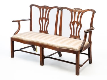 CHIPPENDALE STYLE MAHOGANY DOUBLE-CHAIRBACK SETEE.