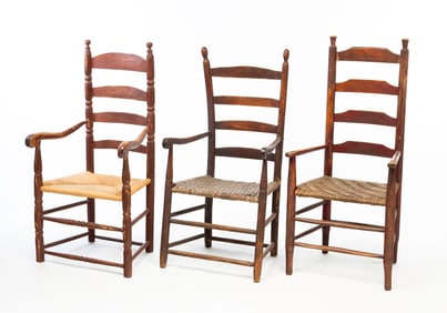 THREE AMERICAN PAINTED LADDERBACK ARMCHAIRS.