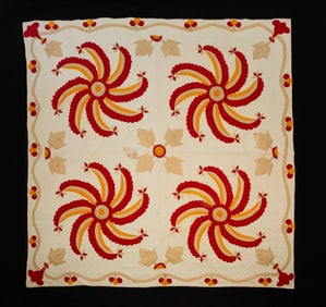 AMERICAN PIECEWORK STYLIZED PINWHEEL QUILT.