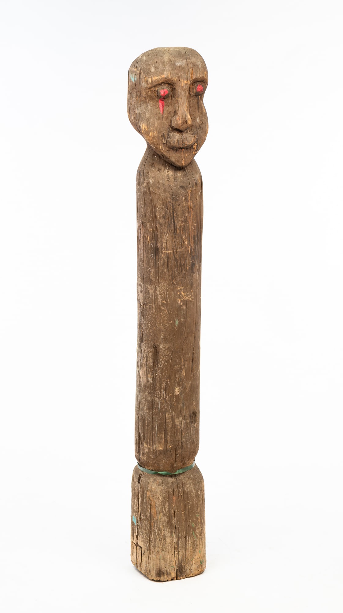 AMERICAN FOLK ART CARVED TOTEM.: American, Early 20th Century. Pine. Totem with head-like features to the top on a cylindrical plain post with square bottom. 62"h. 7.5"w.Provenance: From the Lifetime Collection of Chuck Auerbach.