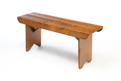 AMERICAN REDDISH-BROWN PAINTED PINE BOOTJACK BENCH.