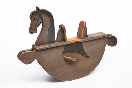 AMERICAN CARVED AND PAINTED WOOD ROCKING HORSE.