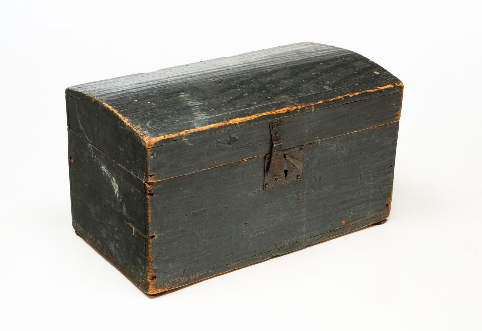 AMERICAN PAINTED DOME TOP CHILD'S TRUNK.: America, Mid-19th Century. Pine. Square nail construction, original hardware and dark blue paint. 11"h. 19.75"w. 10.5"d.
